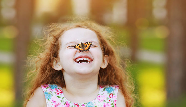 Happy-girl-with-butterfly-on-nose-edit-1